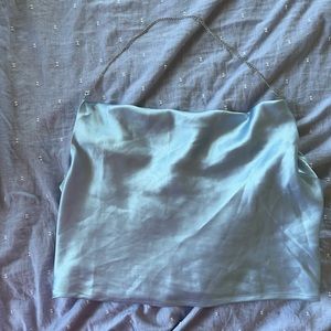 Light blue satin draped blouse with chain strap. Stretchy back and nice material